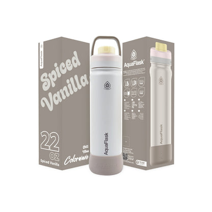 Botella de agua de acero inoxidable con aislamiento de la colección Colorwave de AquaFlask en color  Spiced Vanilla con acabado degradado suave, tapa de rosca con asa de transporte y base de silicona, fotografiada sobre fondo blanco