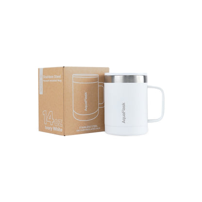Taza térmica AquaFlask en color Ivory White con acabado blanco mate suave, borde de acero inoxidable, asa ergonómica y tapa antiderrames, fotografiada sobre fondo blanco